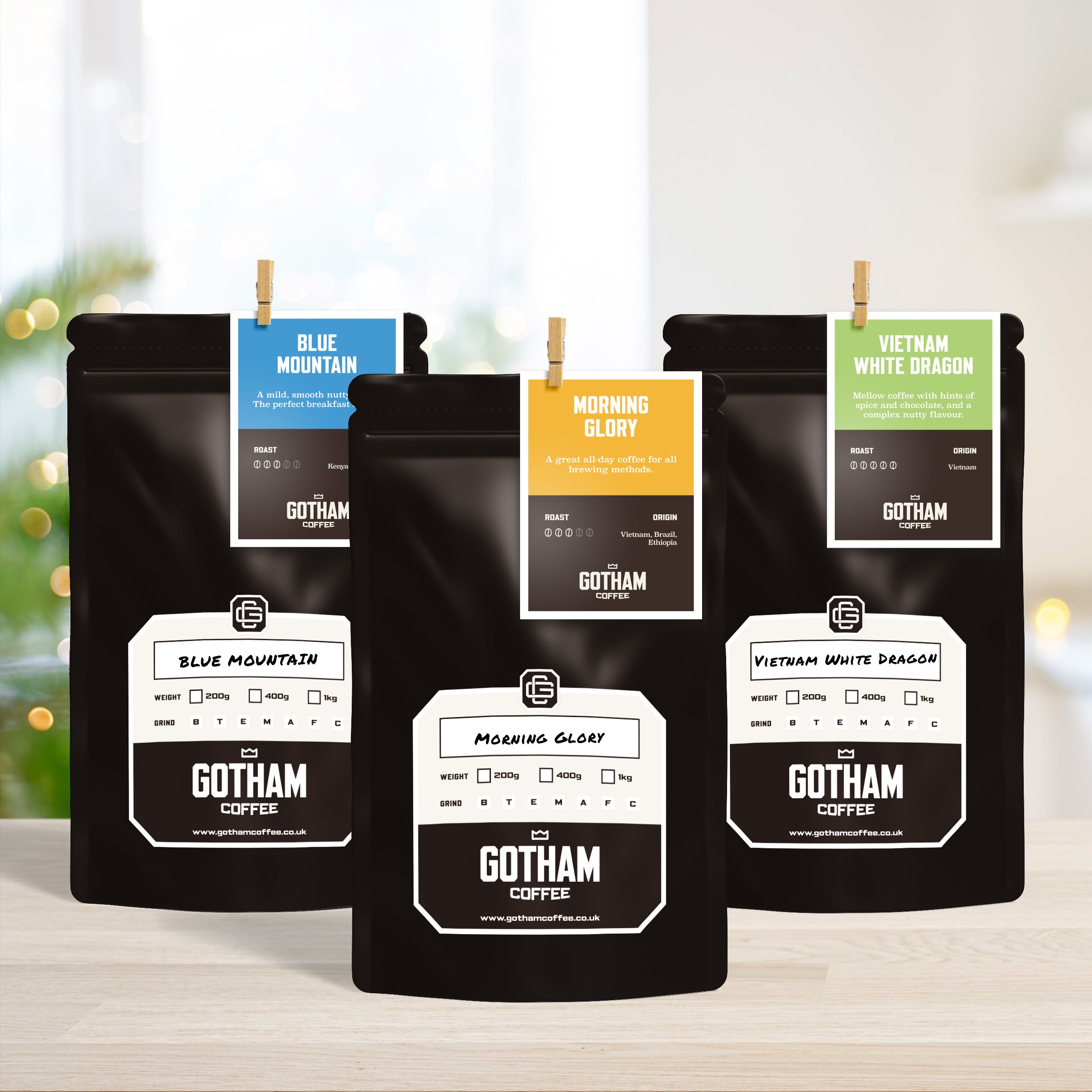 Gotham Coffee bags with various coffee types on a blurred background